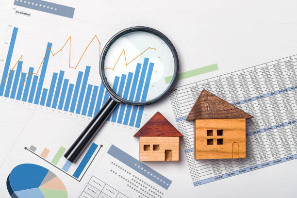 A table depicting data analysis, featuring a magnifying glass, a graph with upward-trending lines, and an illustration of a house, symbolizing growth in the Australian loan market.