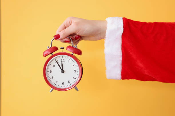 Santa Claus holding a clock, symbolizing the countdown to Christmas and the urgency of last-minute gift holiday shopping.